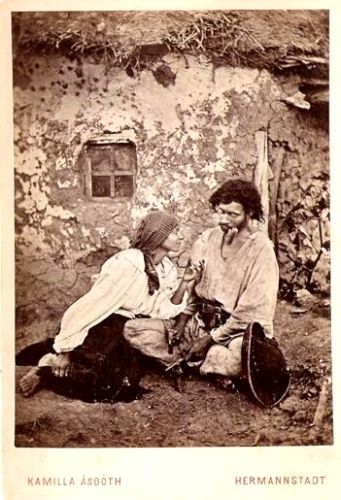 Pair of gypsies in front of the cottage